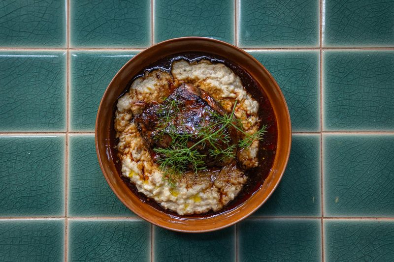 Traditional French coq au vin served with creamy mashed potatoes