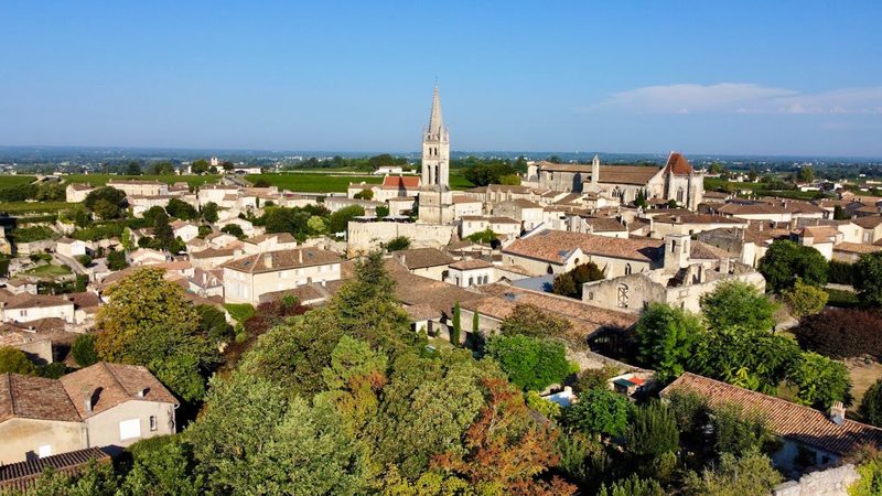 Aerial view of Saint-Emilion, France showcasing Gothic architecture and surrounding vineyards