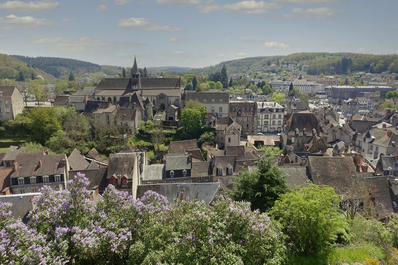 Scenic view of a charming French village with colorful blooming flowers in spring