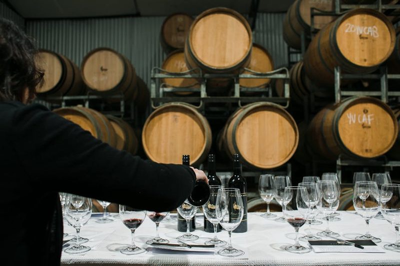 Sommelier pouring wine into glass at a Loire Valley winery